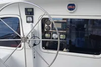 Steering wheel and control panel of 2001 Catamaran NIMBLE 50 yacht.