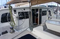 2001 Catamaran NIMBLE 50 cockpit with dual steering wheels and marina view.