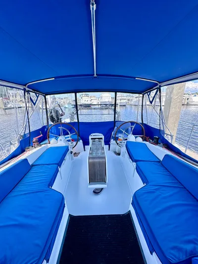 Volare Yacht Photos Pics Cockpit of 2014 Jeanneau Sun Odyssey 44 DS with blue seating and dual steering wheels.