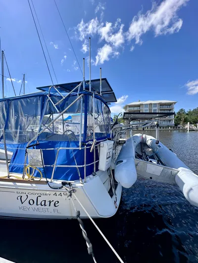 Volare Yacht Photos Pics 2014 Jeanneau Sun Odyssey 44 DS sailboat docked in Key West marina under clear blue sky.