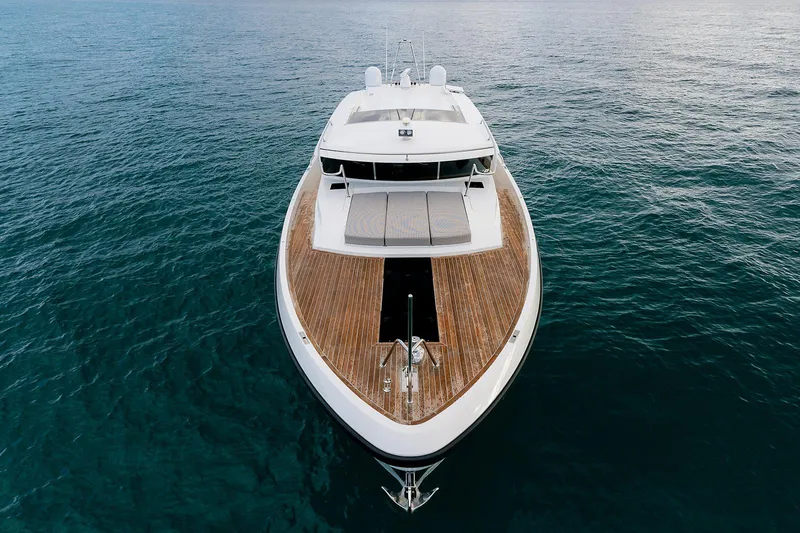 Freya Yacht Photos Pics 2023 Delta Powerboats 54 IPS yacht on open water, showcasing sleek design and wooden deck.