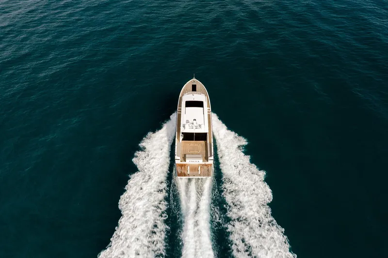 Freya Yacht Photos Pics Aerial view of 2023 Delta Powerboats 54 IPS cruising on open water.