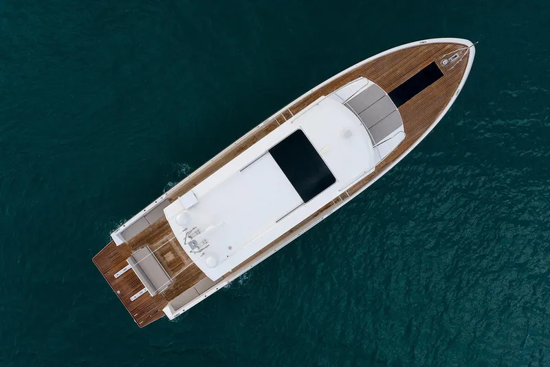 Freya Yacht Photos Pics Aerial view of 2023 Delta Powerboats 54 IPS yacht on blue water.