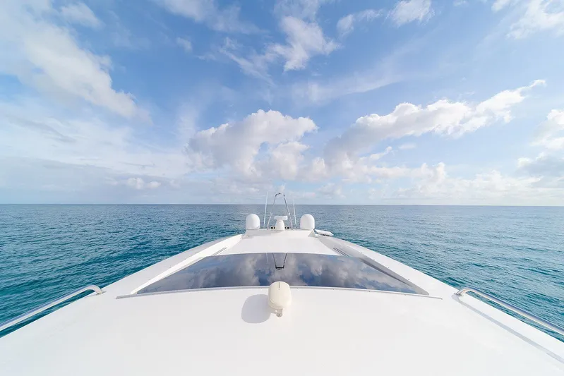 Freya Yacht Photos Pics Delta Powerboats 54 IPS 2023 cruising on open sea under blue sky.