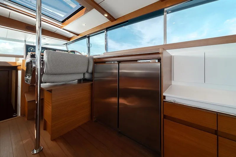 Freya Yacht Photos Pics Interior of 2023 Delta Powerboats 54 IPS, featuring modern wood and stainless steel finishes.