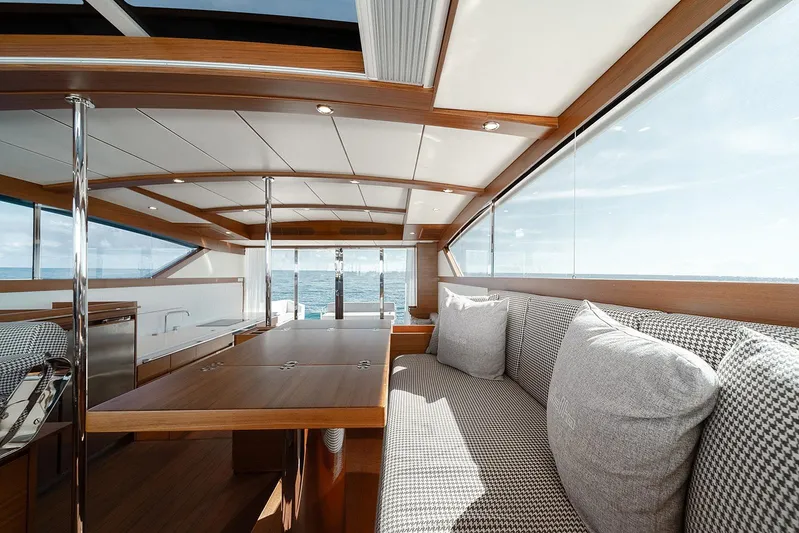 Freya Yacht Photos Pics Luxurious interior of 2023 Delta Powerboats 54 IPS with ocean view and elegant seating.