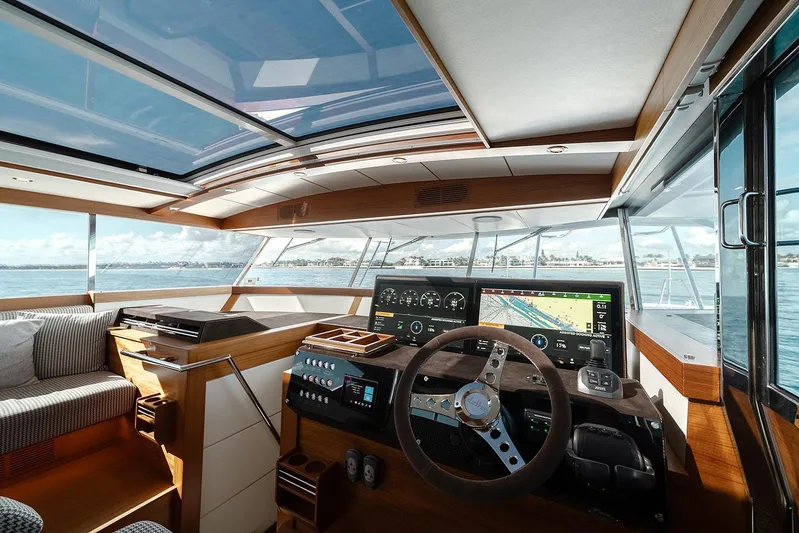 Freya Yacht Photos Pics Luxurious interior of 2023 Delta Powerboats 54 IPS with modern navigation system and panoramic views.