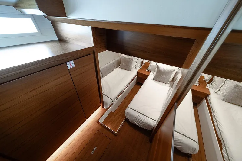 Freya Yacht Photos Pics Luxurious cabin interior of 2023 Delta Powerboats 54 IPS with twin beds and wooden finish.