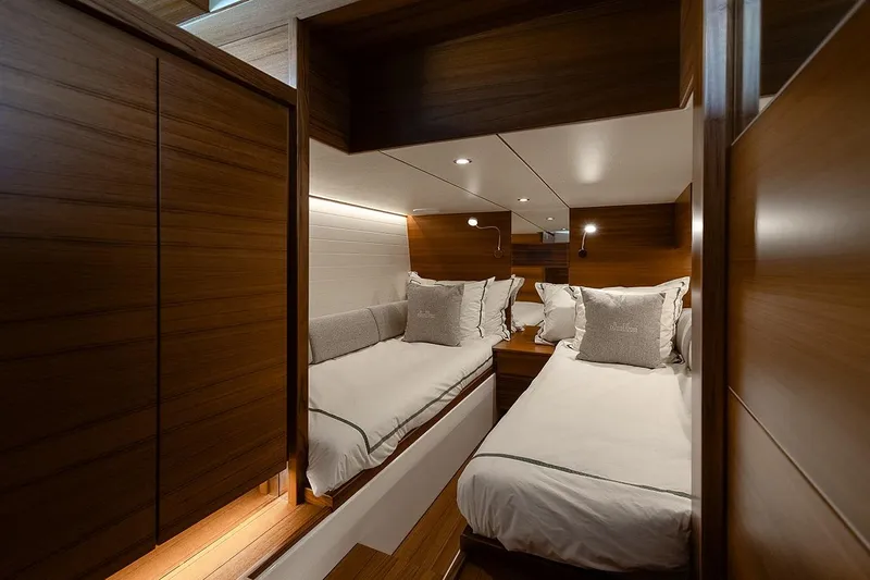 Freya Yacht Photos Pics Luxurious cabin interior of 2023 Delta Powerboats 54 IPS with twin beds and elegant wood finish.