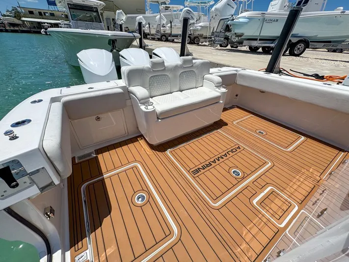 Aquamarine Yacht Photos Pics 2019 HCB 39 Speciale boat with teak deck and white seating.