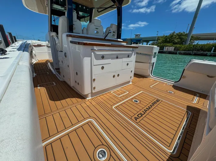 Aquamarine Yacht Photos Pics 2019 HCB 39 Speciale boat interior with teak flooring and seating.