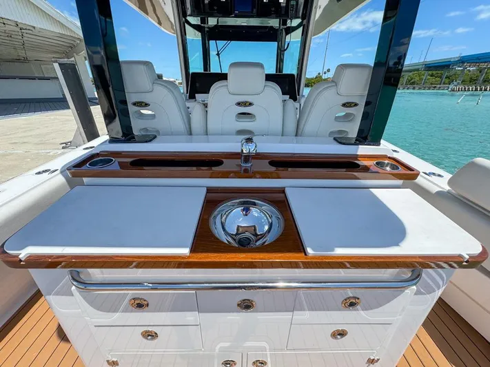 Aquamarine Yacht Photos Pics 2019 HCB 39 Speciale boat interior with sleek white seating and polished wood accents.