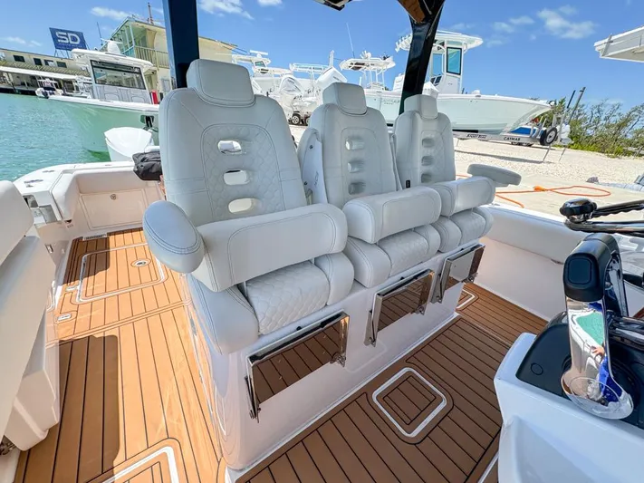 Aquamarine Yacht Photos Pics Luxurious seating on 2019 HCB 39 Speciale boat with teak flooring.