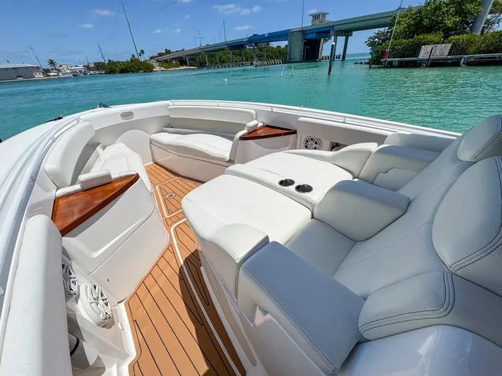 Aquamarine Yacht Photos Pics Luxurious 2019 HCB 39 Speciale boat interior with plush seating and scenic water view.
