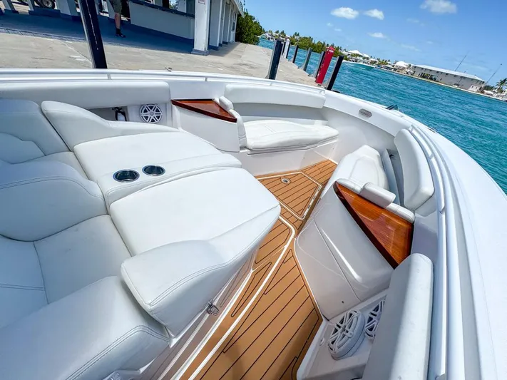 Aquamarine Yacht Photos Pics Luxurious 2019 HCB 39 Speciale boat interior with white seating and wooden accents.
