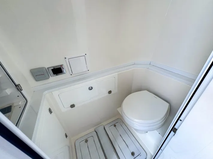 Aquamarine Yacht Photos Pics 2019 HCB 39 Speciale boat bathroom interior with white fixtures and compact design.