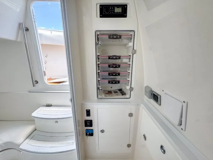 Aquamarine Yacht Photos Pics Interior of 2019 HCB 39 Speciale boat with control panel and seating area.