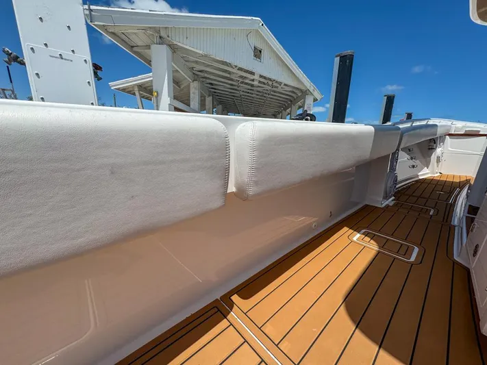 Aquamarine Yacht Photos Pics 2019 HCB 39 Speciale boat deck with cushioned side rail and wooden flooring.