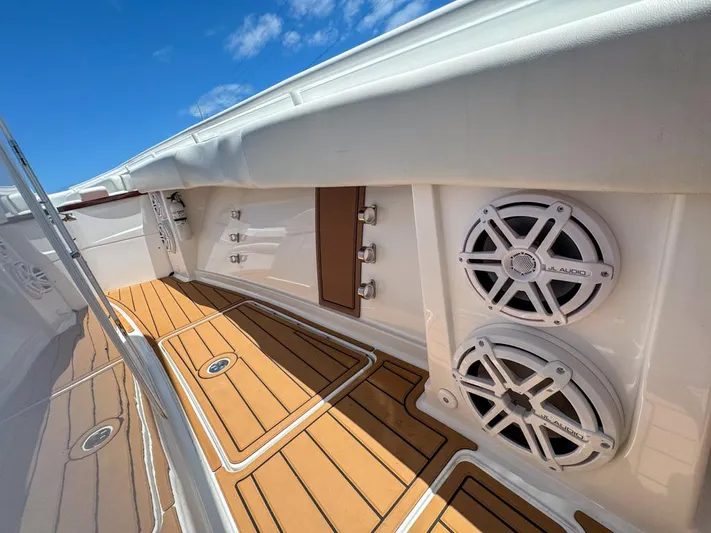 Aquamarine Yacht Photos Pics 2019 HCB 39 Speciale boat interior with speakers and teak flooring.
