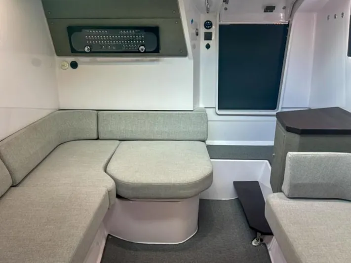  Yacht Photos Pics 2024 Axopar 37XC CROSS CABIN interior with modern seating and sleek design.