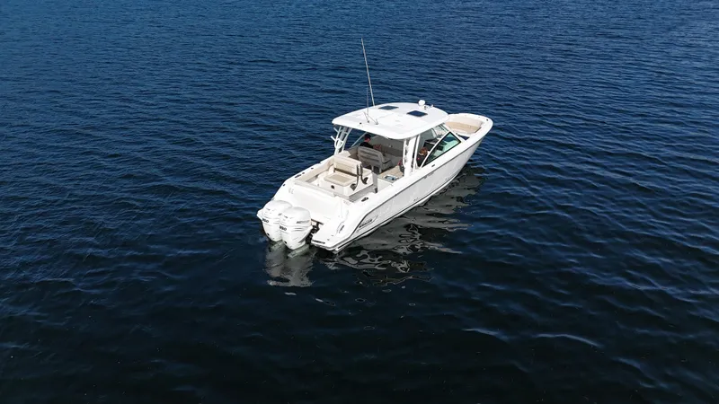  Yacht Photos Pics 2019 Boston Whaler 320 Vantage boat on calm blue water.