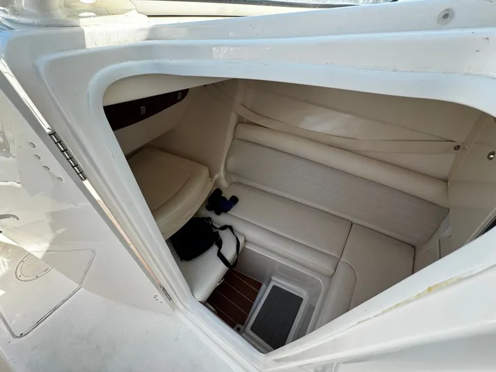 None Yacht Photos Pics Interior cabin of 2022 Grady-White Freedom 325 boat, featuring seating and storage.