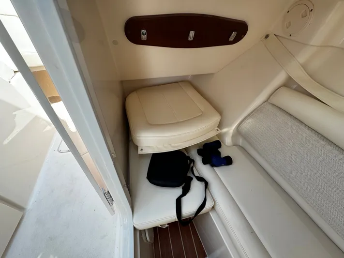 None Yacht Photos Pics 2022 Grady-White Freedom 325 cabin interior with seating and accessories.