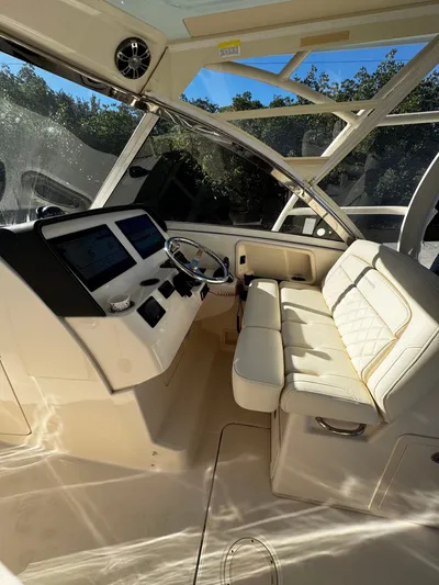 None Yacht Photos Pics 2022 Grady-White Freedom 325 boat interior with modern helm and cushioned seating.