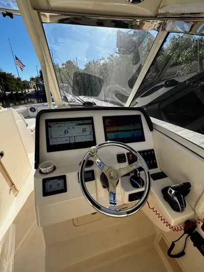None Yacht Photos Pics 2022 Grady-White Freedom 325 boat helm with modern controls and navigation screens.