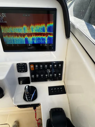 None Yacht Photos Pics Control panel of 2022 Grady-White Freedom 325 boat with Garmin display and switches.
