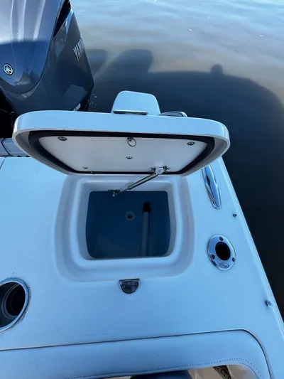 None Yacht Photos Pics Open storage compartment on 2022 Grady-White Freedom 325 boat, near Yamaha engine.