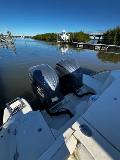 None Yacht Photos Pics 2022 Grady-White Freedom 325 boat with dual Yamaha engines in a serene marina setting.