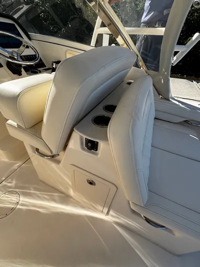 None Yacht Photos Pics 2022 Grady-White Freedom 325 boat interior with white seating and cup holders.