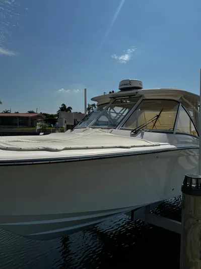 None Yacht Photos Pics 2022 Grady-White Freedom 325 boat docked under clear blue sky.