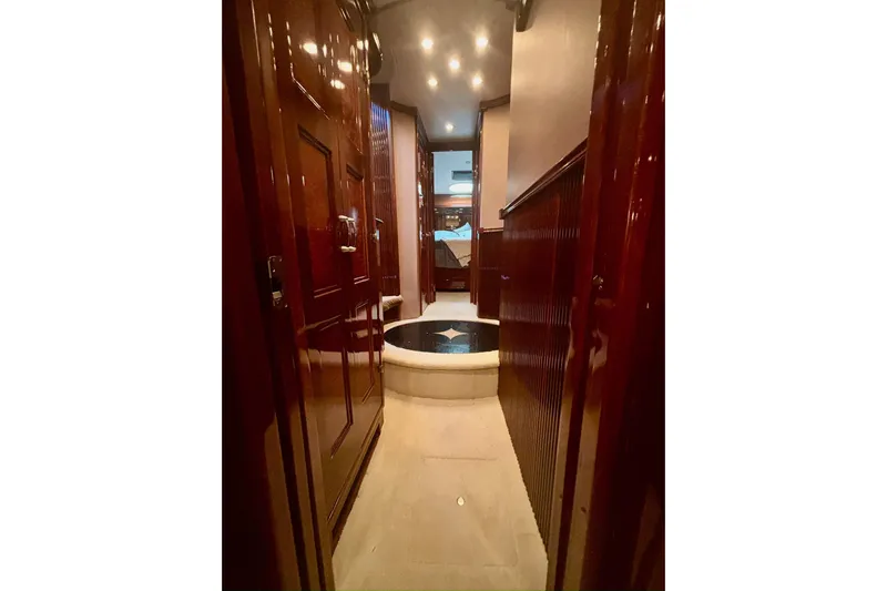  Yacht Photos Pics Luxurious interior hallway of 2004 Marquis 59 yacht with polished wood finishes.