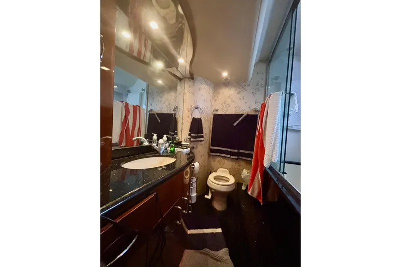  Yacht Photos Pics Luxurious bathroom in 2004 Marquis 59 yacht with elegant fixtures and modern design.