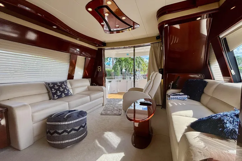  Yacht Photos Pics Luxurious 2004 Marquis 59 yacht interior with elegant seating and modern design elements.