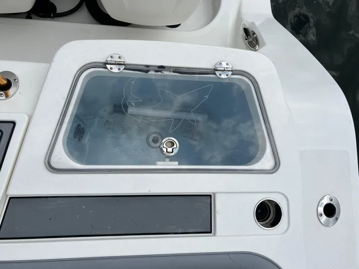 The Perfect Predator Yacht Photos Pics Livewell on 2017 Mako 414 CC Bluewater Family Edition boat, featuring a shark design.