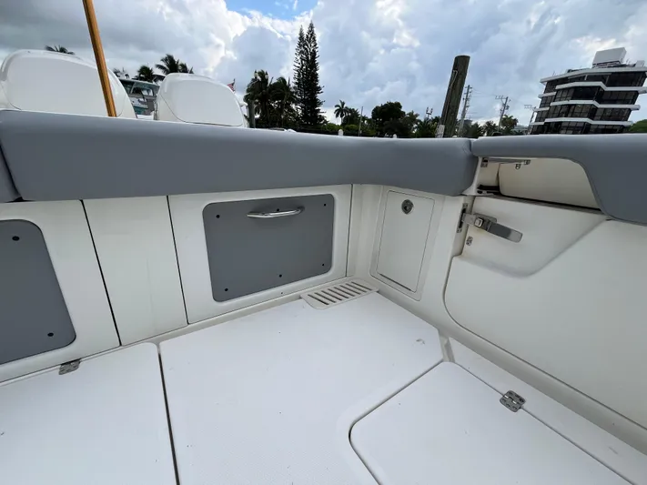 The Perfect Predator Yacht Photos Pics 2017 Mako 414 CC Bluewater boat interior with storage compartments and seating.