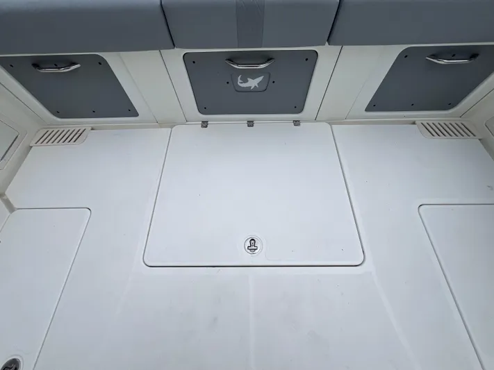 The Perfect Predator Yacht Photos Pics 2017 Mako 414 CC Bluewater Family Edition boat deck with storage compartments.