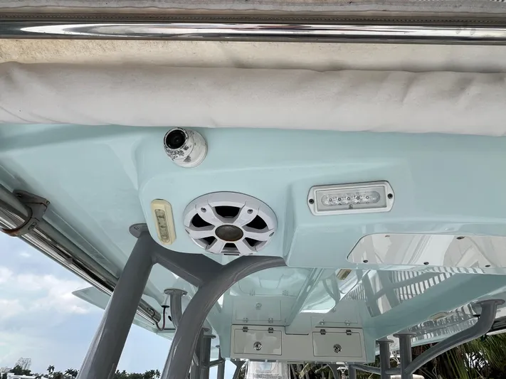 The Perfect Predator Yacht Photos Pics 2017 Mako 414 CC Bluewater Family Edition boat interior with speaker and light fixtures.