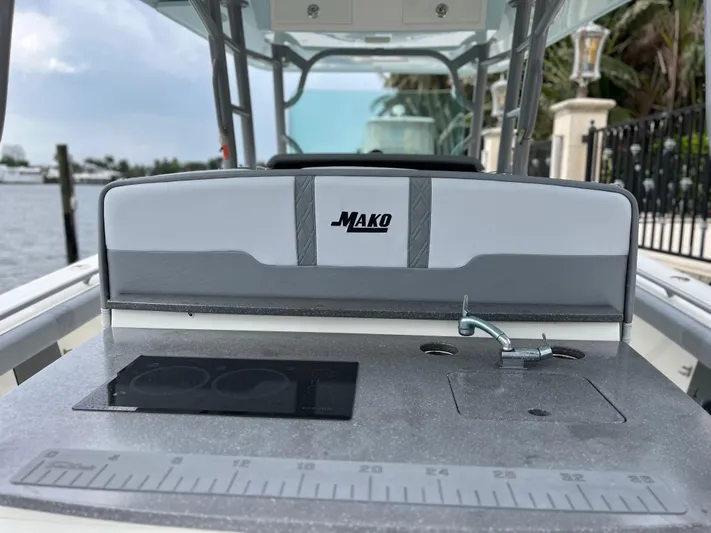 The Perfect Predator Yacht Photos Pics 2017 Mako 414 CC Bluewater Family Edition boat interior with fishing station and sink.