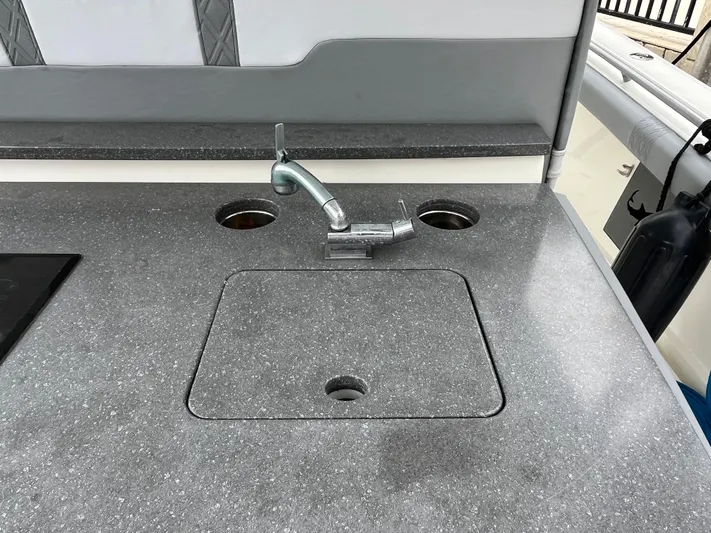 The Perfect Predator Yacht Photos Pics 2017 Mako 414 CC Bluewater Family Edition boat sink and countertop detail.