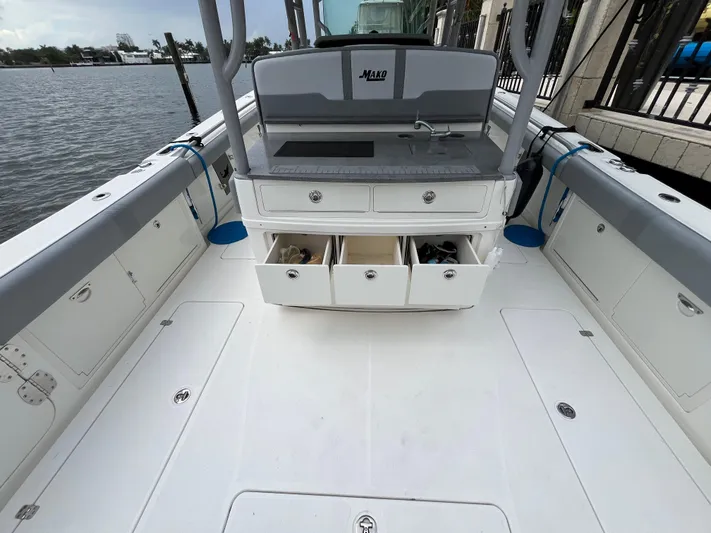The Perfect Predator Yacht Photos Pics 2017 Mako 414 CC Bluewater boat interior with open storage drawers and sink.
