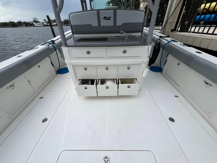 The Perfect Predator Yacht Photos Pics 2017 Mako 414 CC Bluewater boat interior with storage drawers open, docked by the water.