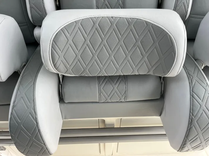 The Perfect Predator Yacht Photos Pics Diamond-patterned upholstery on 2017 Mako 414 CC Bluewater Family Edition boat seats.