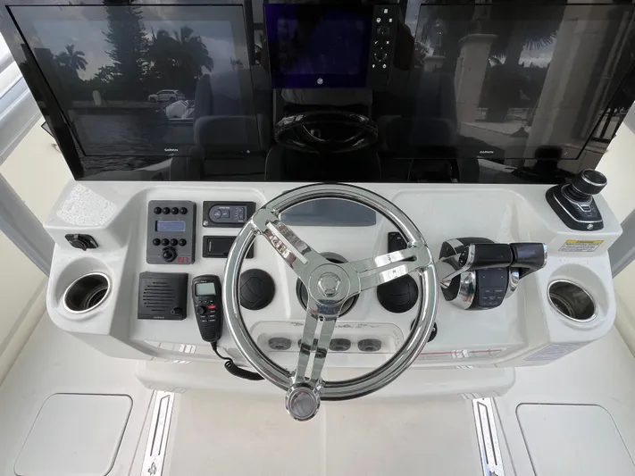 The Perfect Predator Yacht Photos Pics 2017 Mako 414 CC Bluewater helm with advanced controls and dual displays.