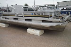 1989 Sea Nymph SS200 SUNCRUISER pontoon boat on display, resting on blocks.