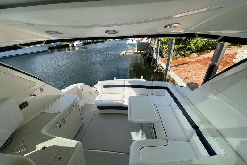 Beach House Yacht Photos Pics Luxurious 2010 Sea Ray 450 Sundancer yacht interior with spacious seating and waterfront view.