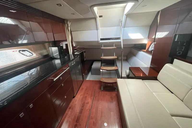 Beach House Yacht Photos Pics Luxurious interior of 2010 Sea Ray 450 Sundancer yacht with modern amenities.